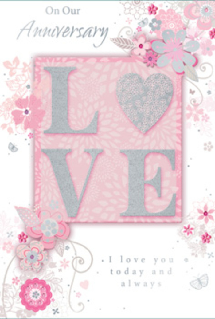 Displayed against a neutral surface, this anniversary card opens a little like stepping into a sunlit Harlesden sitting room where love is woven into everyday life. The main motif-the word LOVE-appears in elegant, raised letters, each stroke dusted with frosted glitter that catches and scatters light, as if reflecting the soft glow over homes near Church Road. The texture is visibly tactile, inviting fingertips to trace the shape of each letter, much like feeling the velvety petals of a rose in a fresh bouquet. Around this central word, wispy, hand-drawn blooms and gentle sprays drift along the card's borders, their colours mingling in refined shades of pink, lilac, and ivory. The blossoms look both stylised and tender, with fine shading that suggests depth, as though layered stems and petals were thoughtfully placed by a skilled florist planning an anniversary arrangement for delivery across Harlesden and Kensal Green. Delicate filigree lines loop between the flowers, interwoven with tiny leaves and barely-there butterflies that seem to flutter at the card's edges, adding a sense of quiet motion and romance. The printed message, reading I love you today and always, is set in a graceful, understated script that harmonises with the botanical design rather than competing with it. Every element-from the soft background hue to the careful balance of white space-contributes to a feeling of calm devotion and gratitude. The card feels as considered and personal as a hand-tied bouquet, a paper expression of enduring love that mirrors the artistry of a local Harlesden florist crafting something meant to be treasured.